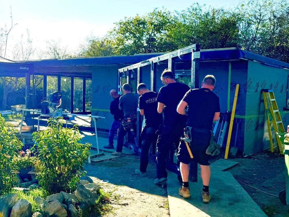Garden Room Doors being carried by men